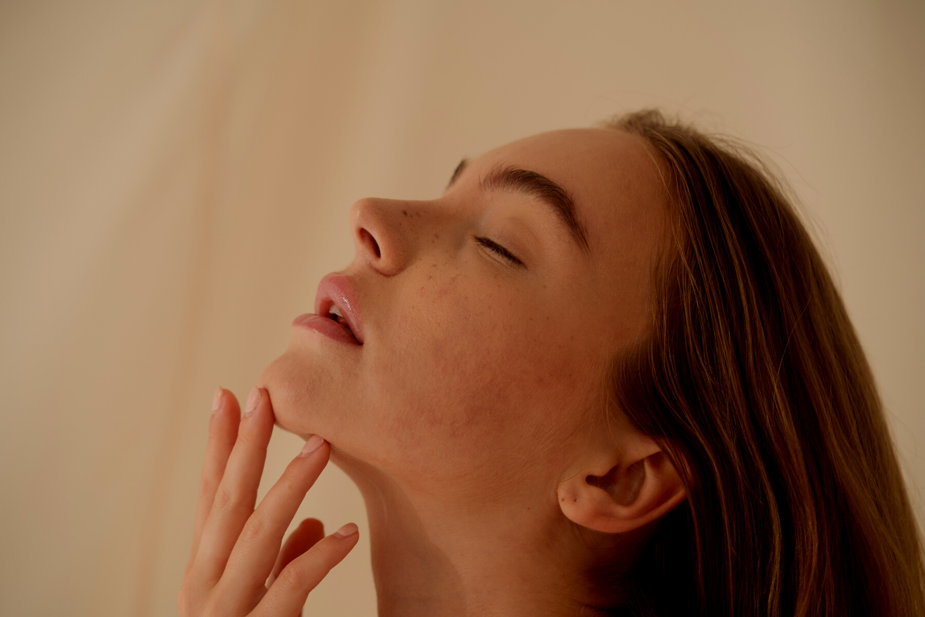 Woman Touching Her Chin